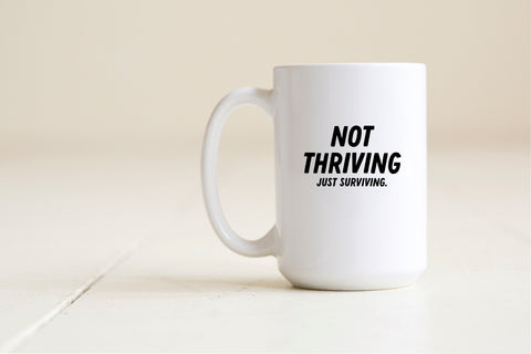 Not thriving just surviving mug